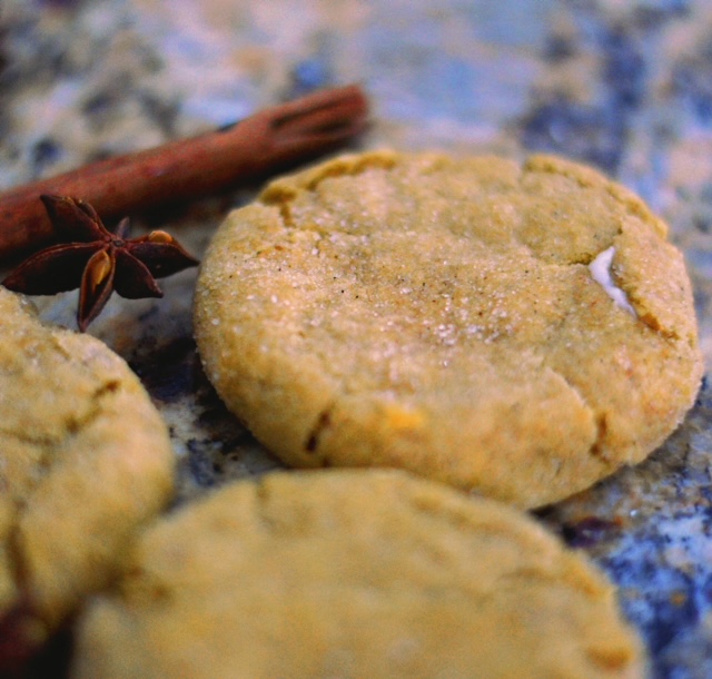 pumpkin cheesecake cookies with cinnamon sticks and star anise in the background