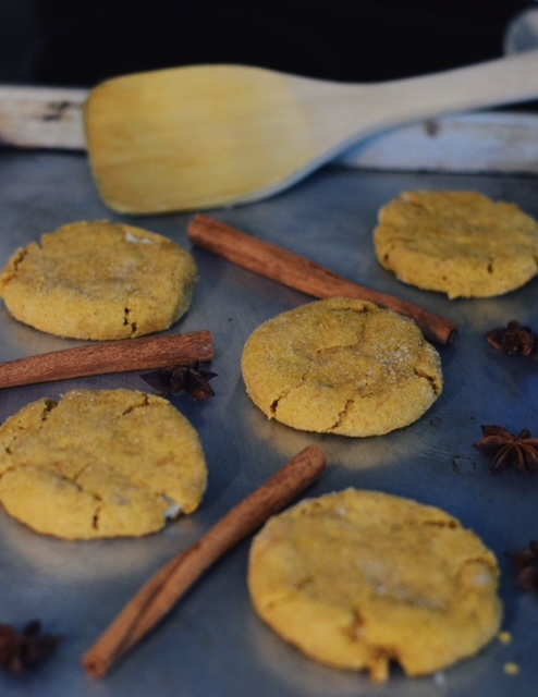 pumpkin cheesecake cookies with cinnamon sticks and star anise in the background