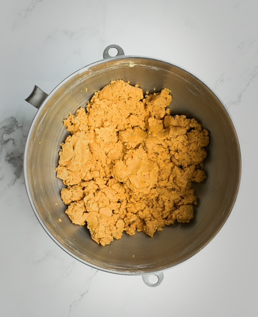 pumpkin cheesecake cookie dough in a stainless steel bowl