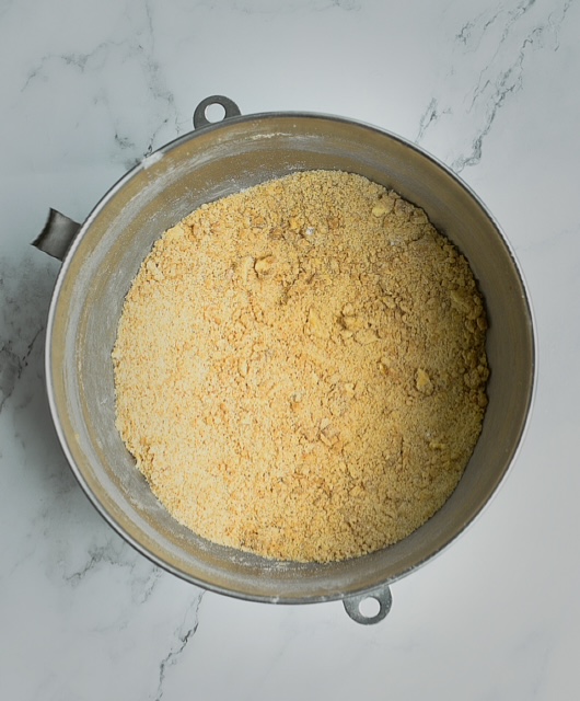 dry ingredients for maple pumpkin cheesecake cookies in a stainless steel mixing bowl