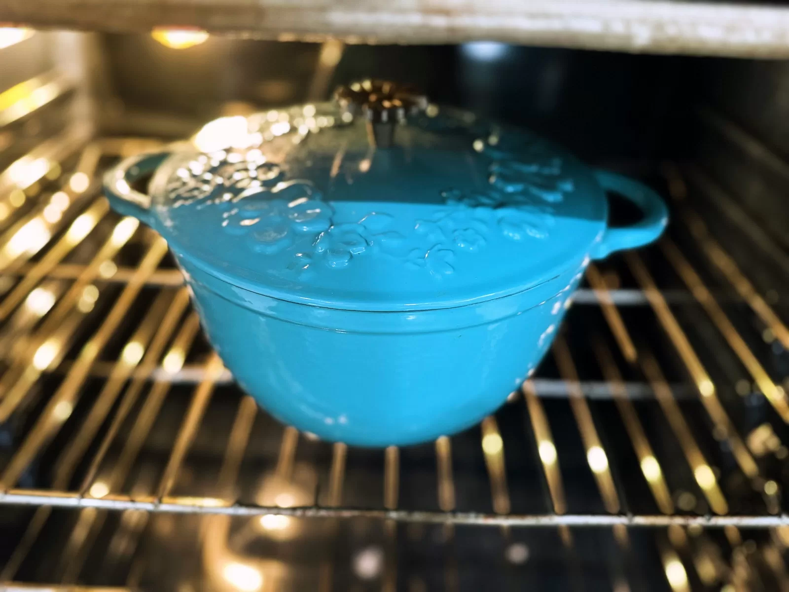 blue dutch oven baking in oven