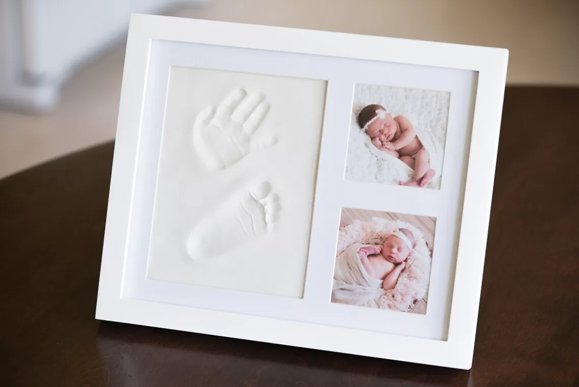 baby handprint and footprint frame with photos