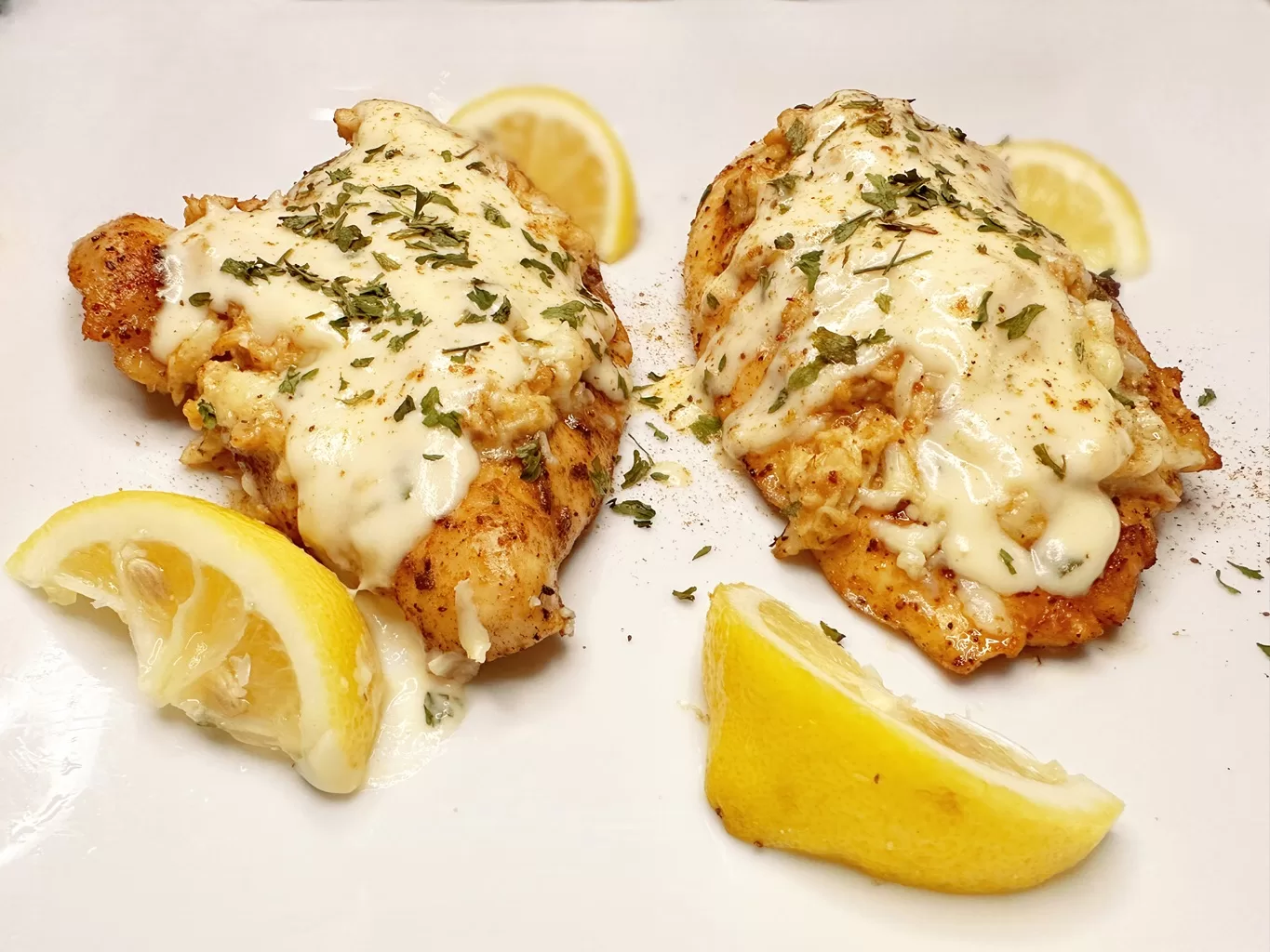 photo of Chicken Chesapeake garnished with lemons and parsley