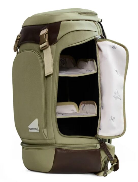 olive green diaper backpack with shelving inside