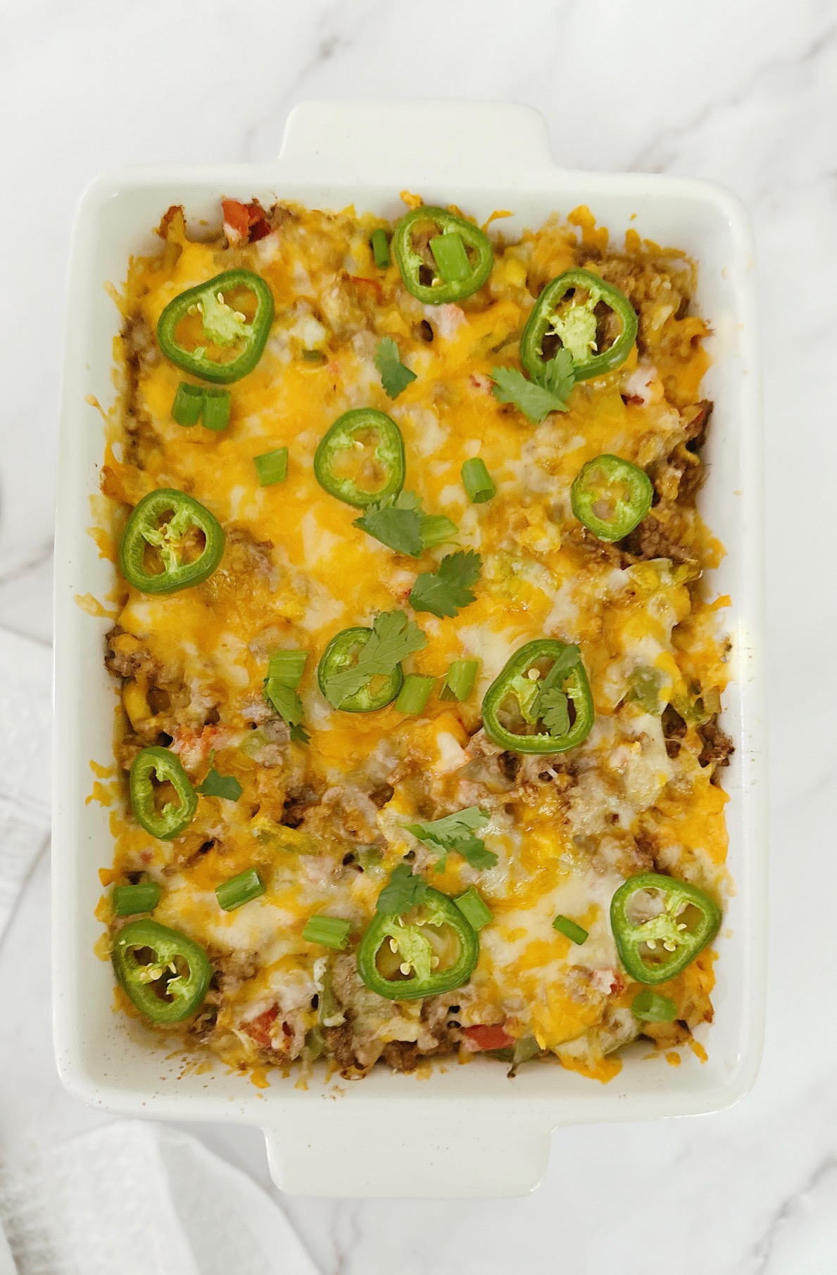 keto mexican taco casserole in a white porcelain baking dish