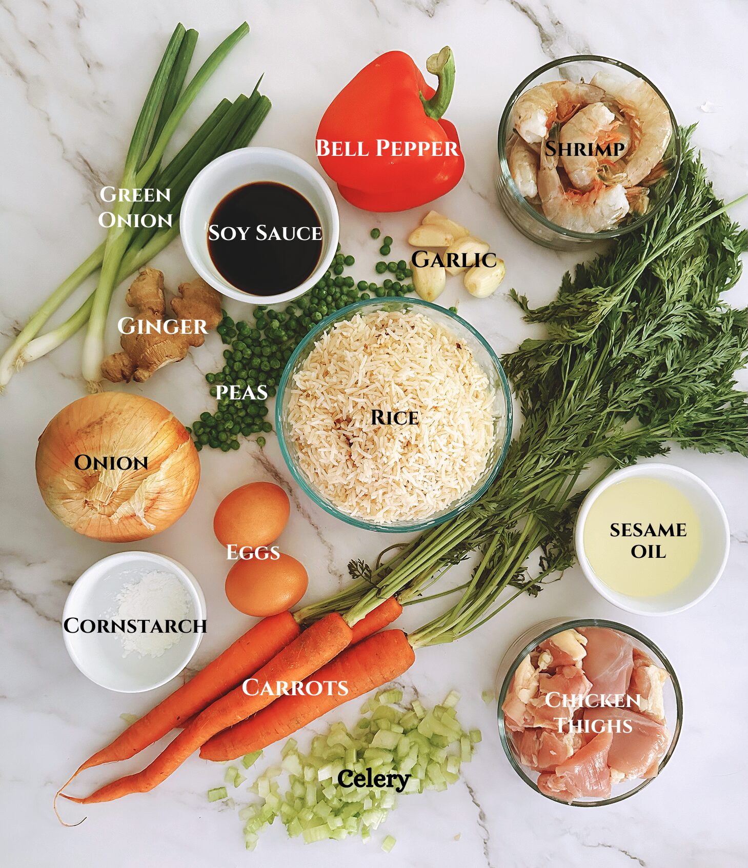 photo of all ingredients used to make chinese chicken and shrimp stir fry laid out on a white marble background