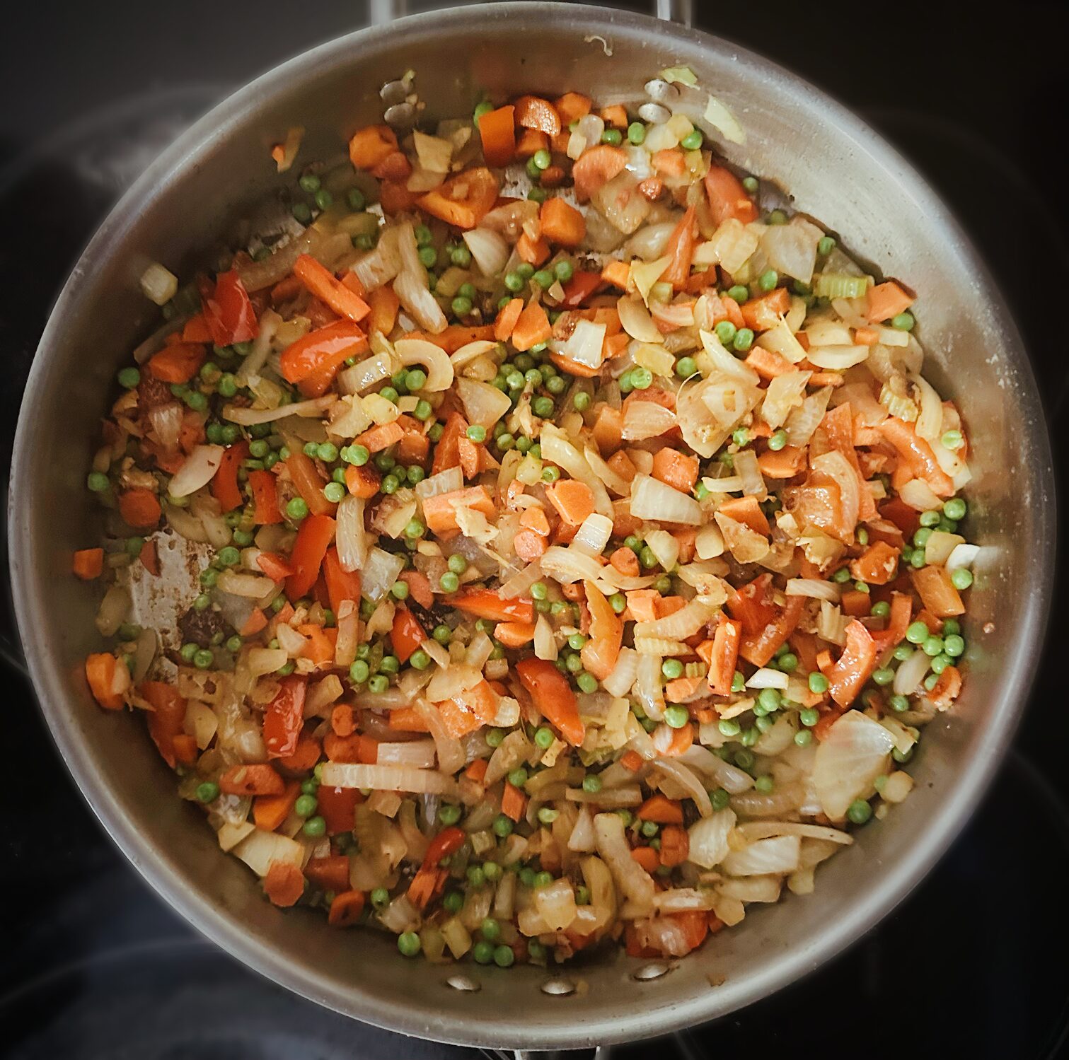 vegetables searing in a frying pan