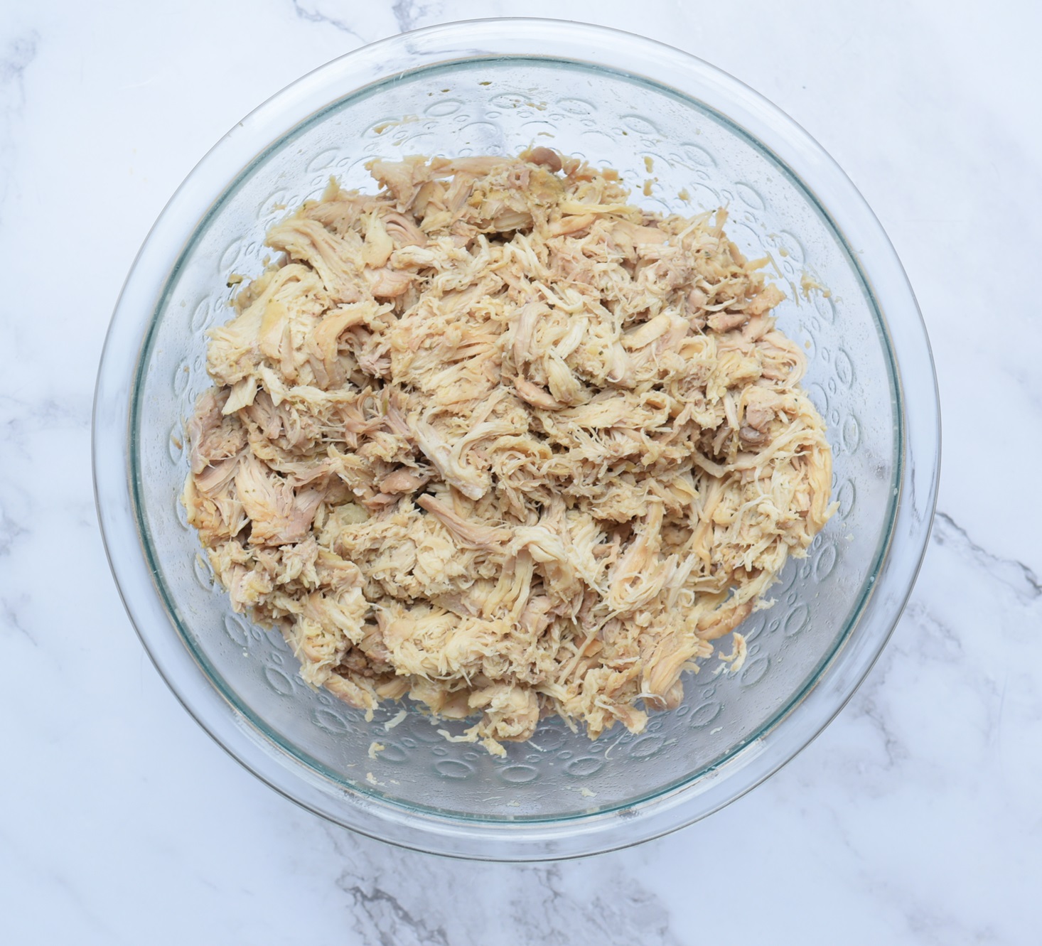 pulled chicken in a glass bowl