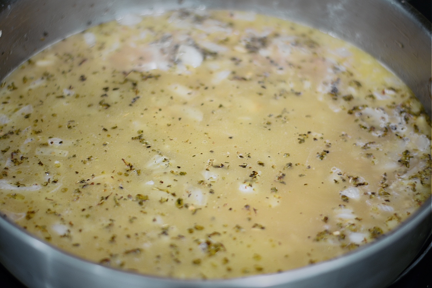 garlic parmesan sauce simmering in a pan