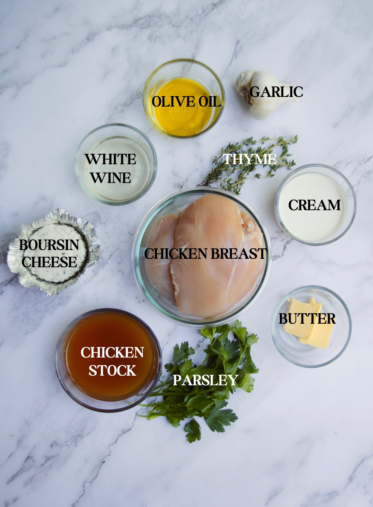 Garlic Herb Boursin Chicken Recipe ingredients against a white marble countertop