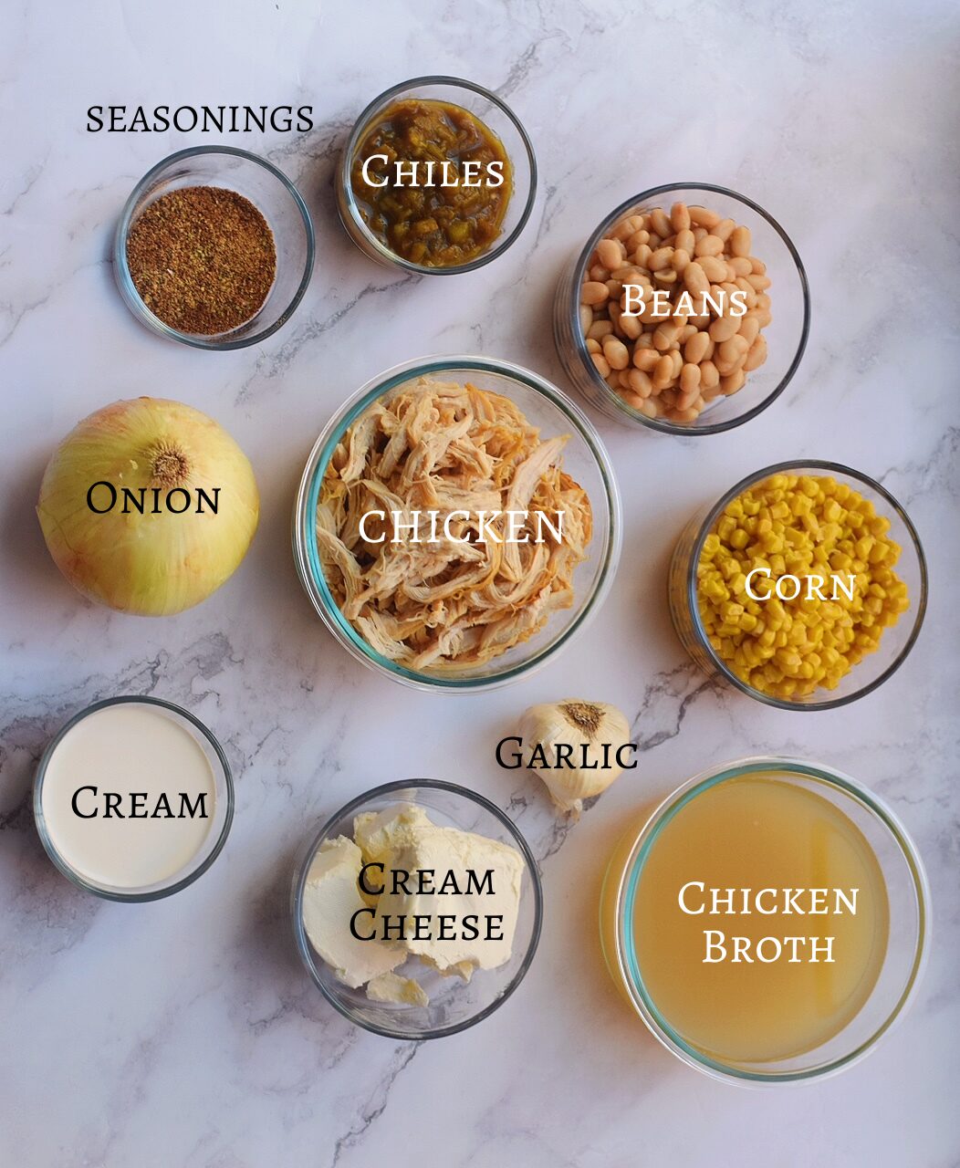 white chicken chili Ingredients laid out on a white countertop with labels