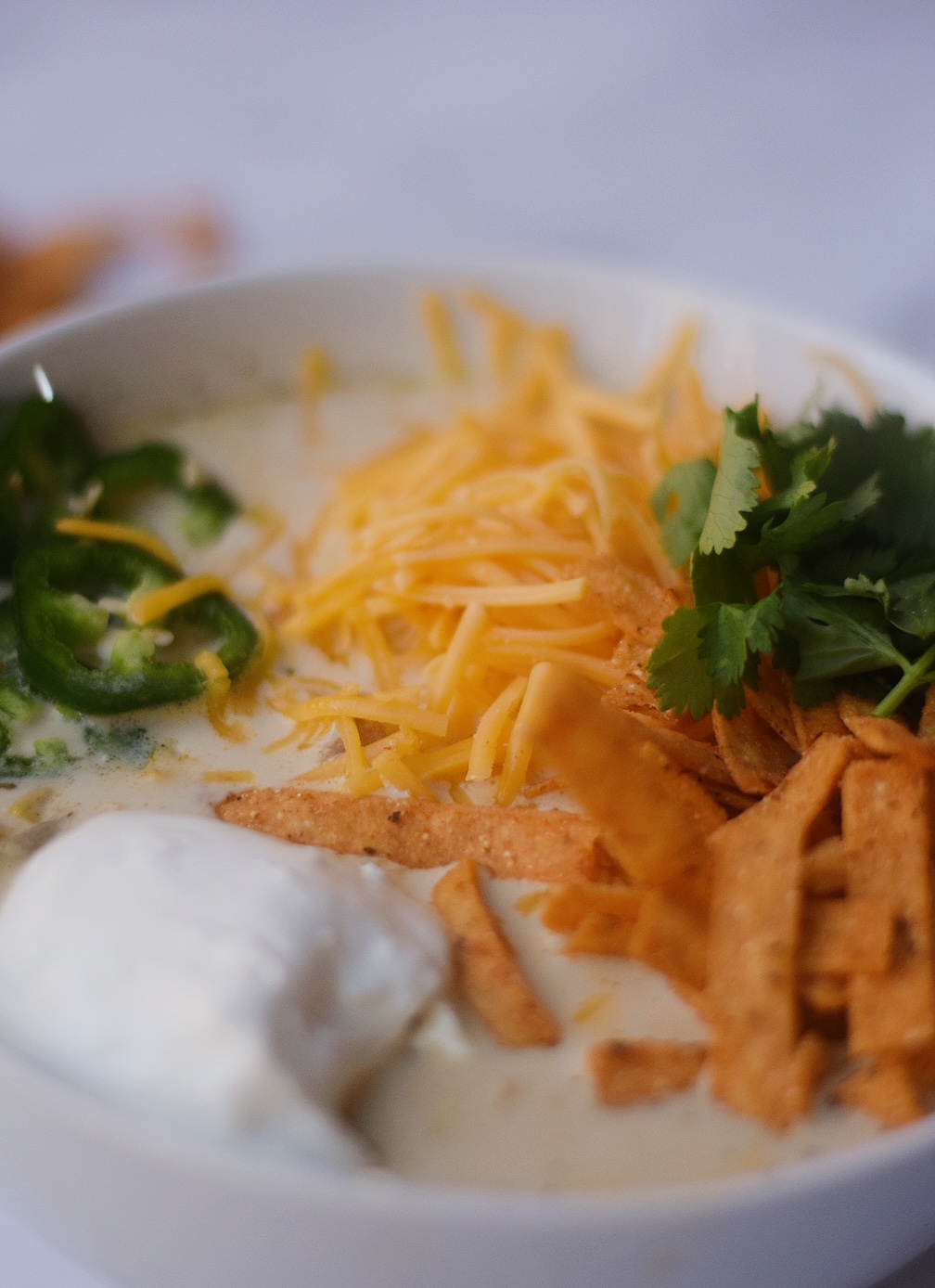 closeup of white chicken chili in a white bowl