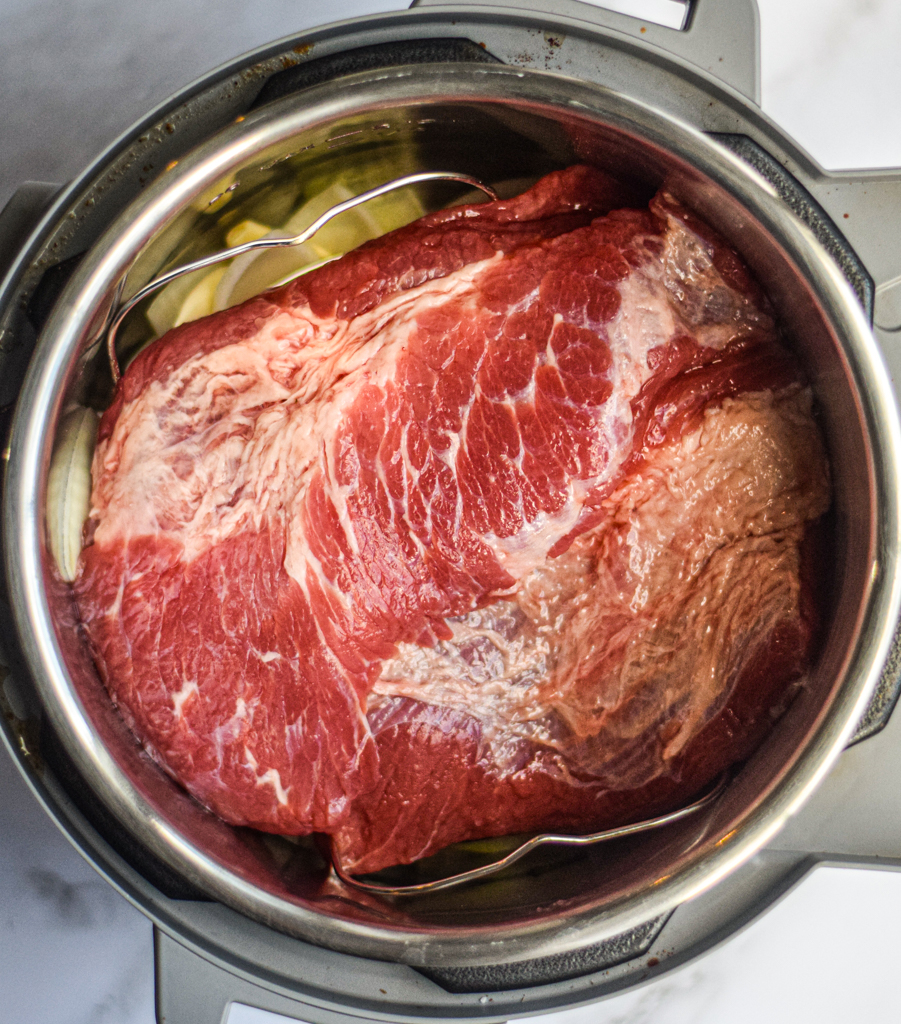 corned beef cooking in a pressure cooker