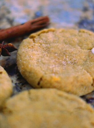 pumpkin cheesecake cookies with cinnamon sticks and star anise in the background