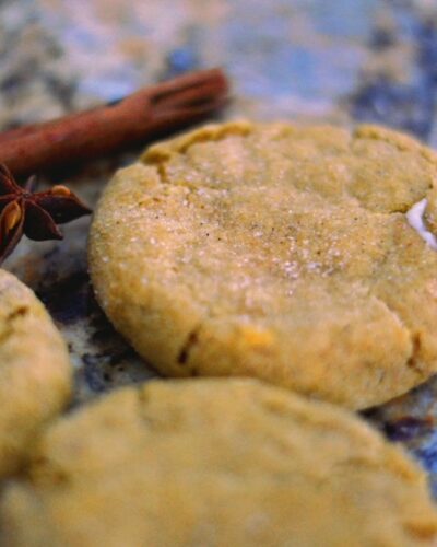 pumpkin cheesecake cookies with cinnamon sticks and star anise in the background