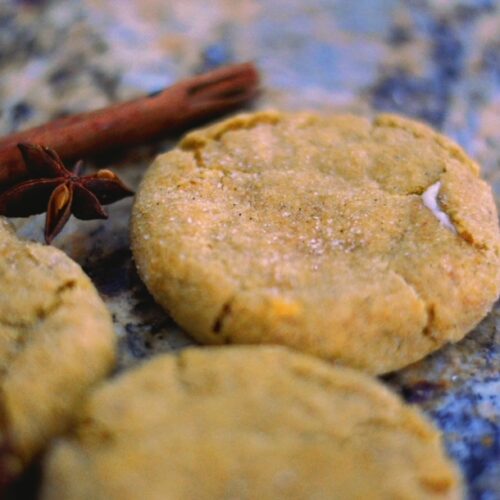 pumpkin cheesecake cookies with cinnamon sticks and star anise in the background