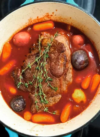 pot roast stew with vegetables in a dutch over