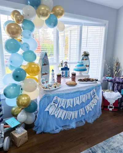 gold and blue party balloon arch