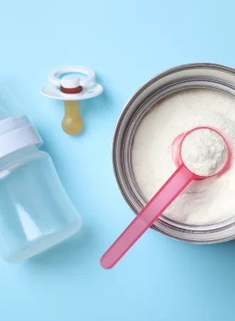 open baby formula can with blue background