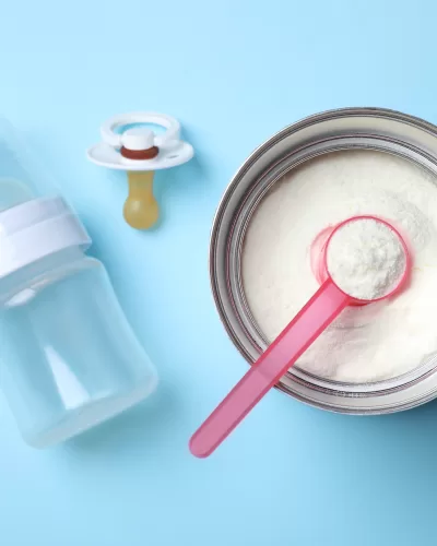 open baby formula can with blue background