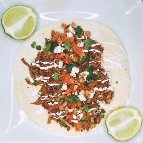 barbacoa taco with limes