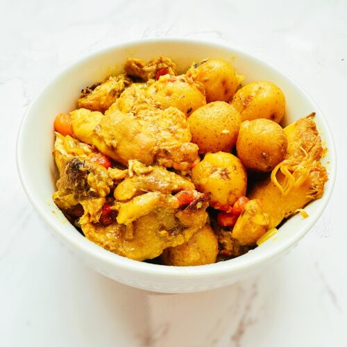 jamaican curry chicken in a white bowl