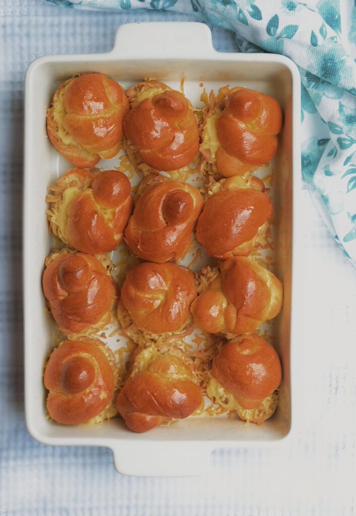 pulled chicken sliders in a white porcelain dish