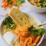 creamy white chicken chili with fresh bread dipped in chili