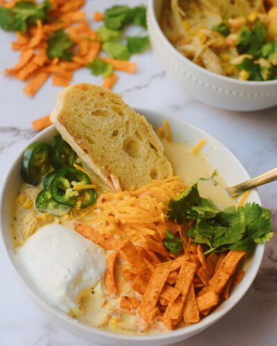 creamy white chicken chili with fresh bread dipped in chili